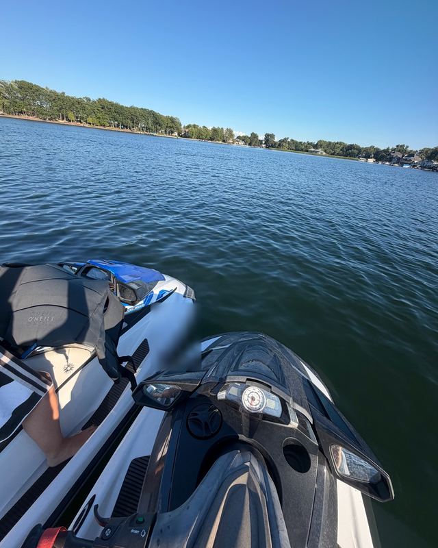 Jet skis on a lake on a sunny day